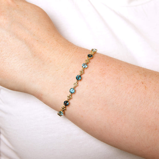 9ct Yellow Gold Blue Topaz Ornate Tennis Bracelet 9ct Yellow Gold Blue Topaz Ornate Tennis Bracelet